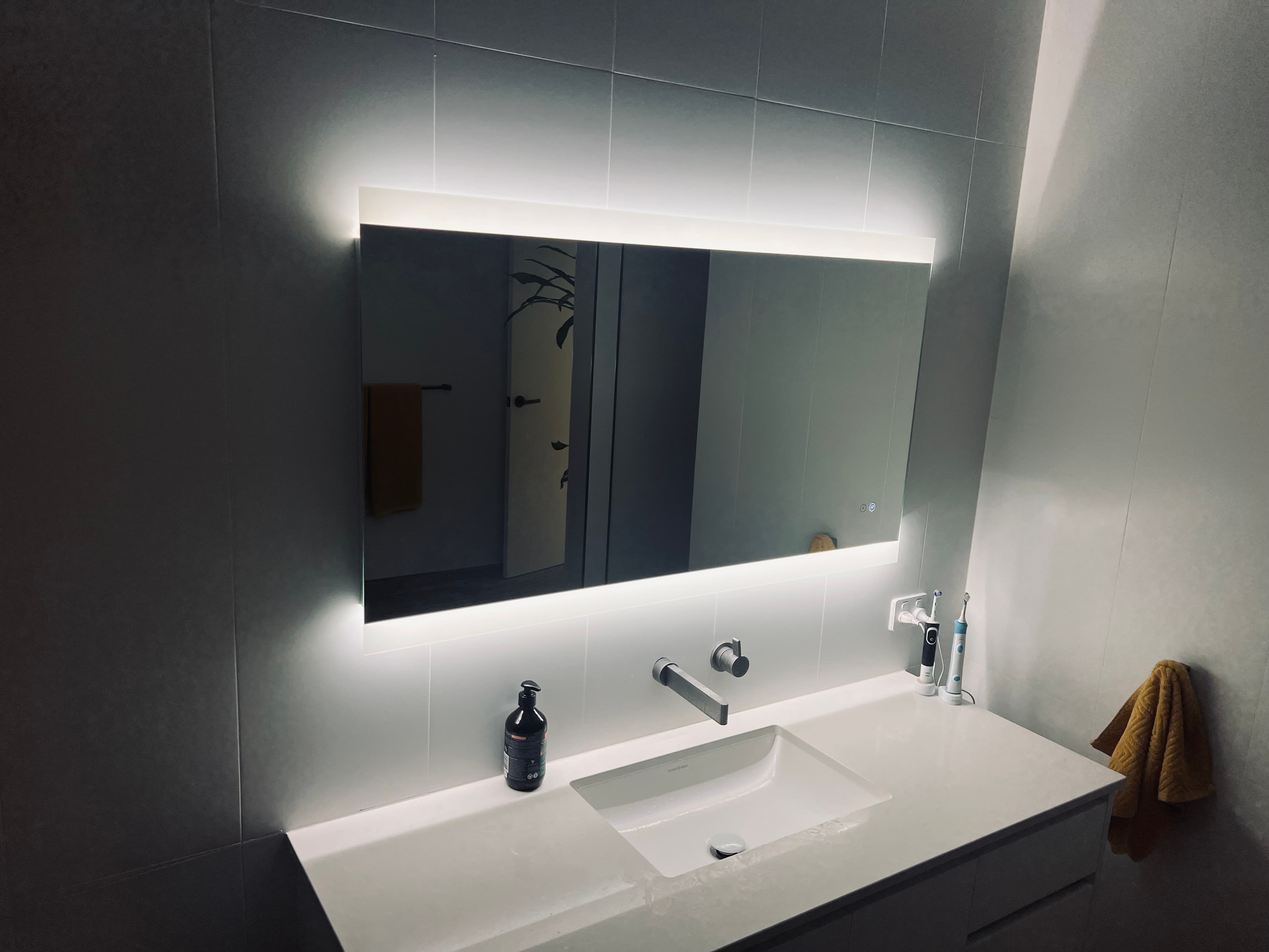 Backlit bathroom mirror